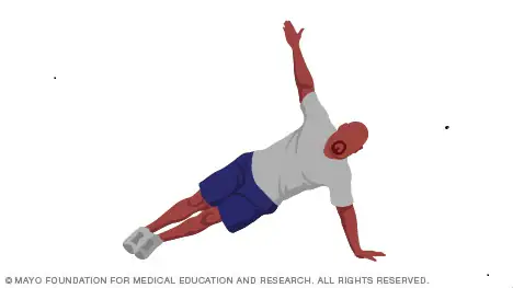 A person doing push ups

Description automatically generated