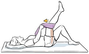 Woman lying on back pulling one thigh to chest with towel.